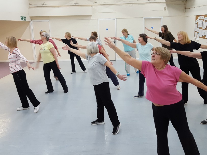 A group of older adults at a dance class