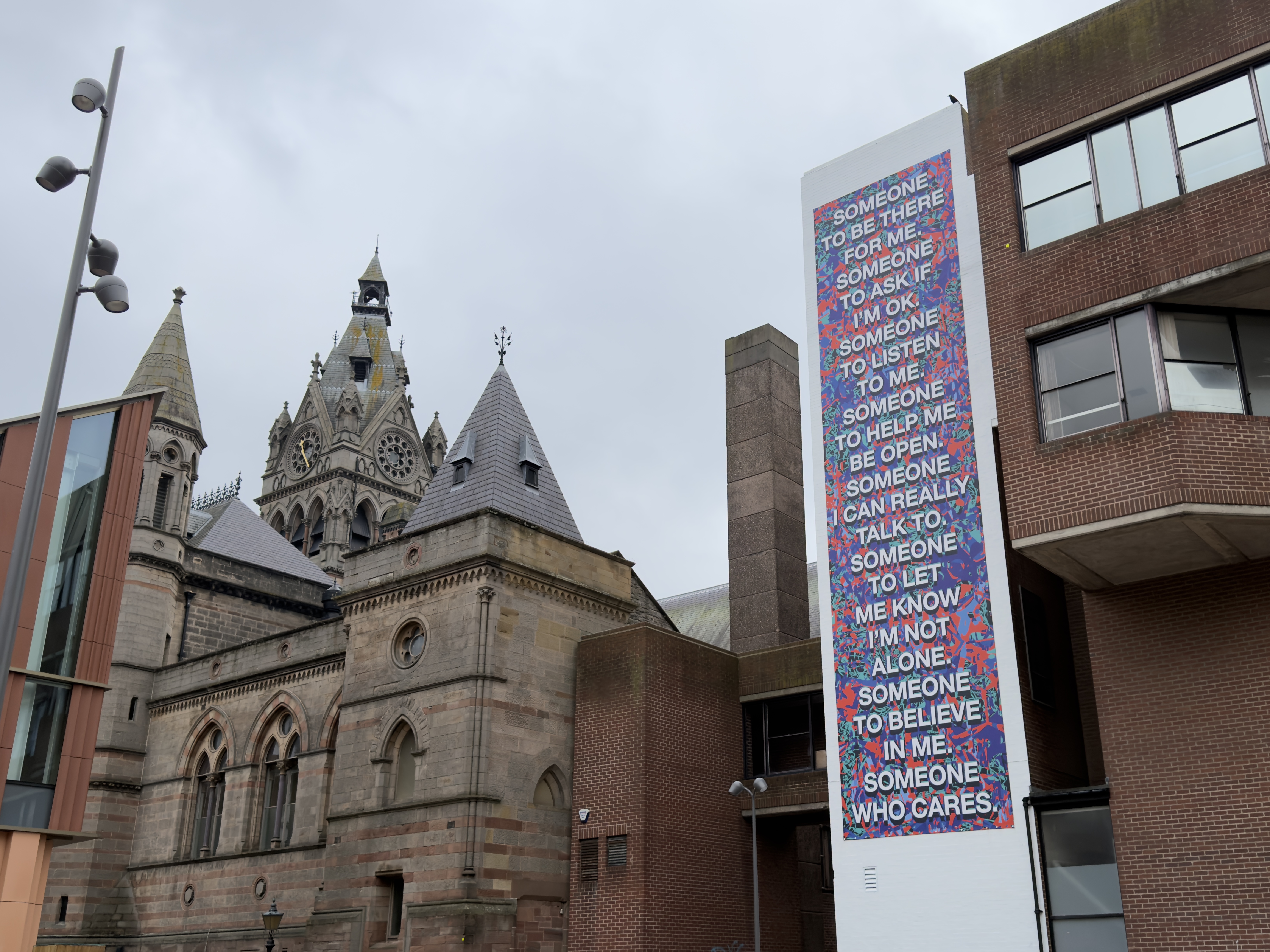 A picture of building with the large artwork on. 