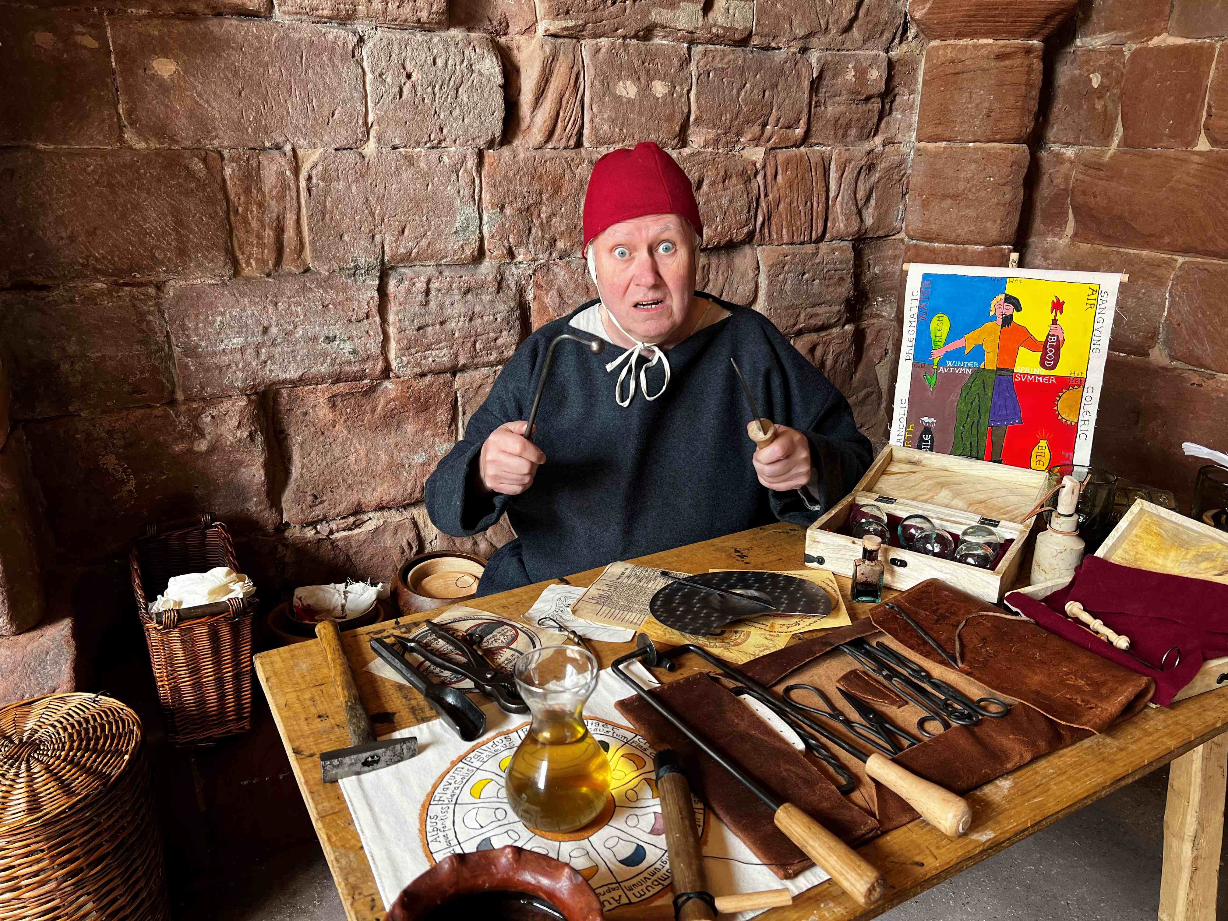 Mike Graham dressed as medieval surgeon Godfrey Garland in a tower on Chester's City Walls.