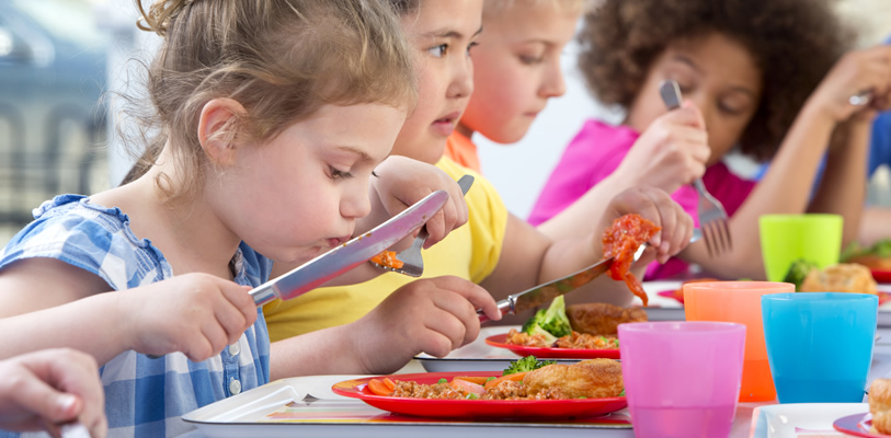 Kids eating a school lunch