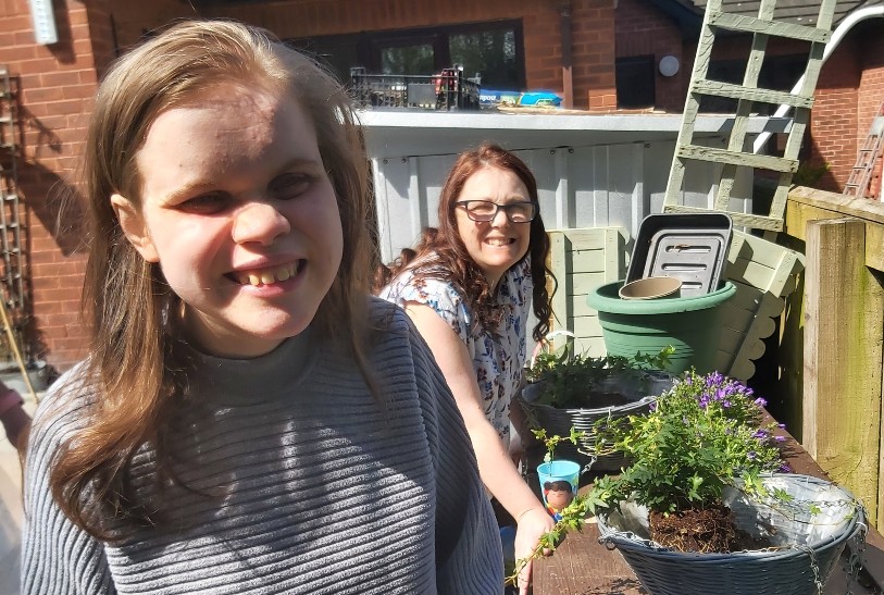 People accessing supported living services keep active in the garden