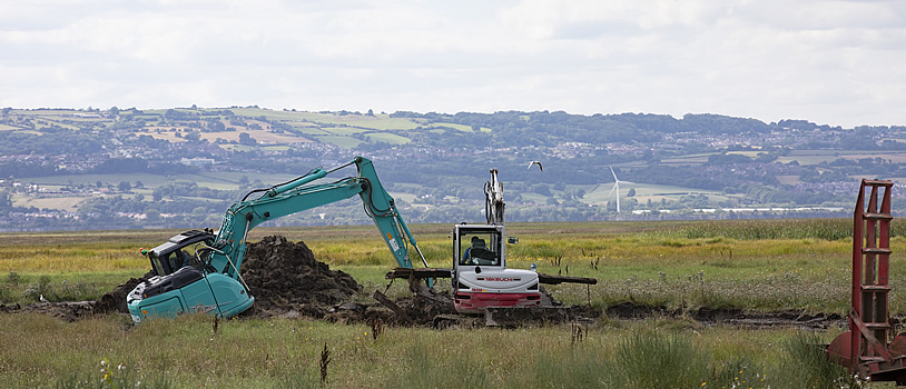 Diggers moving earth for the new Parkgate pond