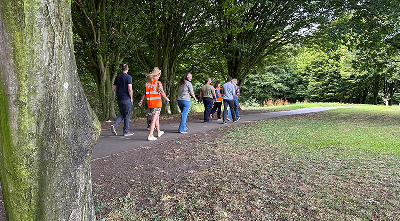 Group of walkers walking in the park