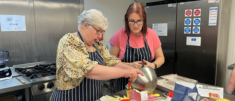 Two people baking in a kitchen.