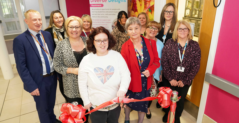 People involved with the new Diverse Designs shop celebrate the grand opening.