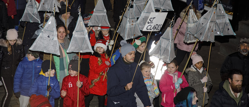 Young people and adults walking in the Chester Lantern Parade 2022.
