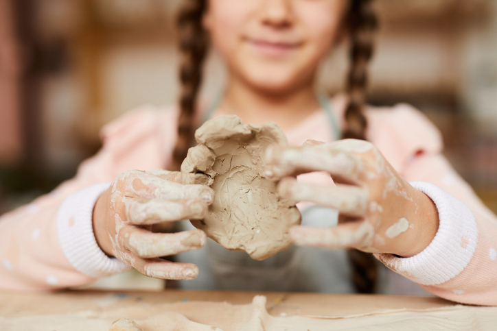 Litle Girl Shaping Clay stock photo