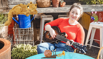 Woman holding a guitar