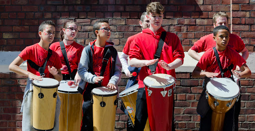 young people holding samba drums