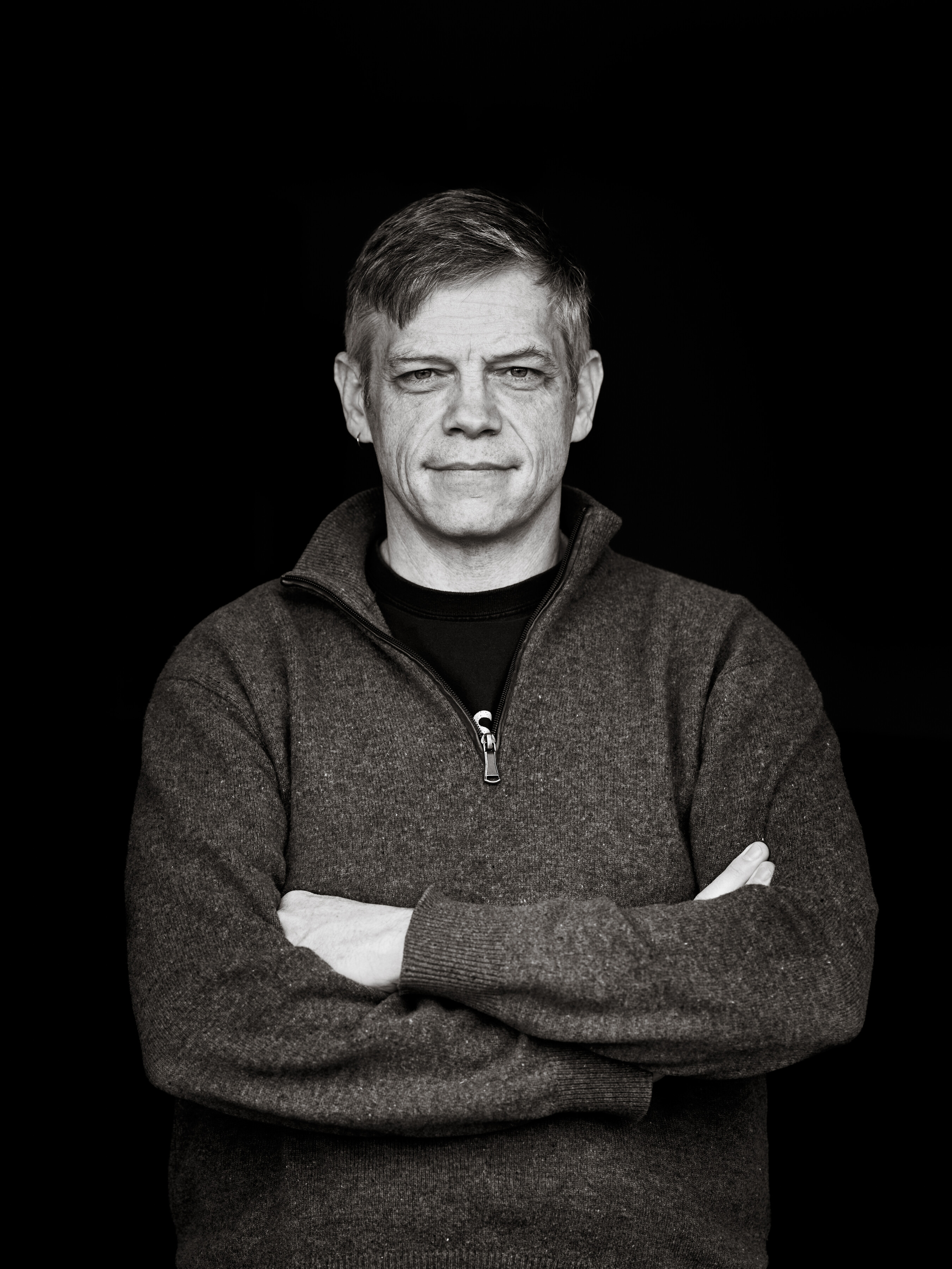 The author ben kane crossing his arms
