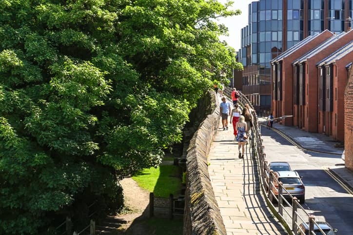 Residents walking across the bridge