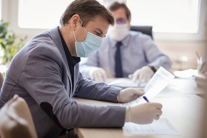 Man signing forms