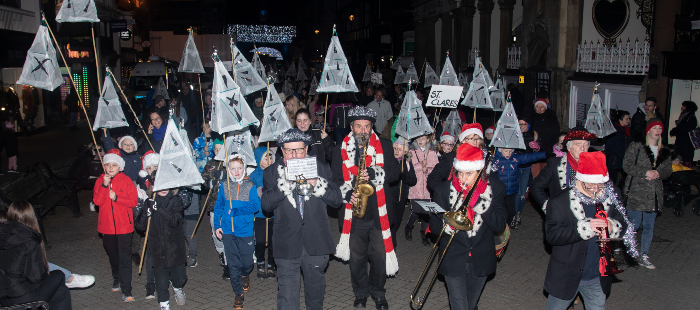The Christmas Lantern Parade led by a Christmas band.