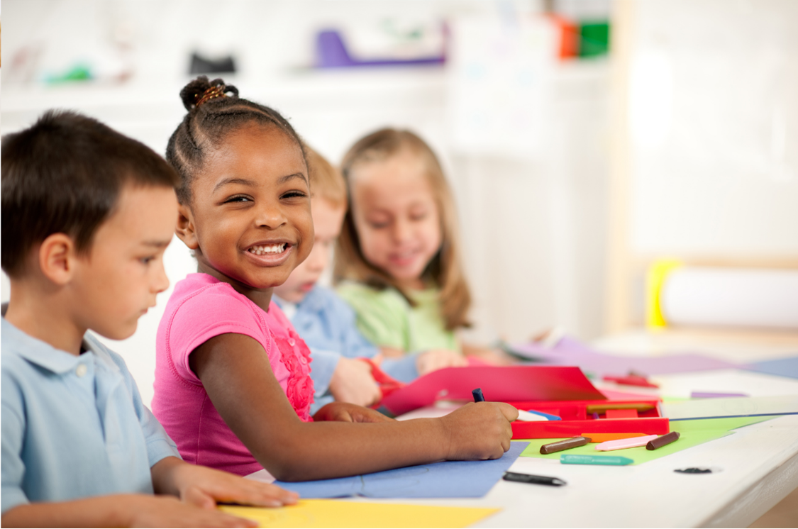 A group of children colouring