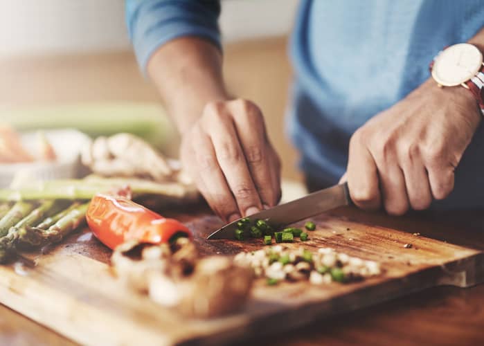 Man chopping vegetables