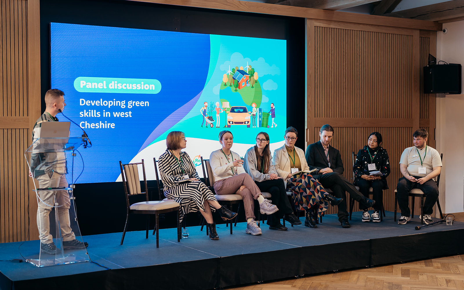 Panellists sitting on a stage having a discussion