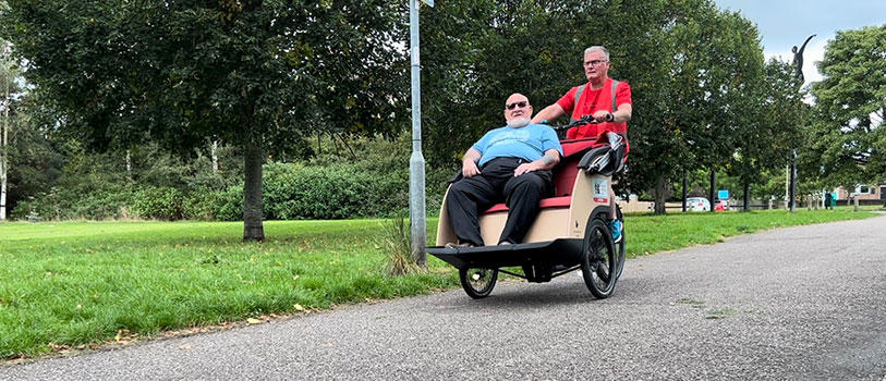 Cycling Without Age officer with an elderly resident.