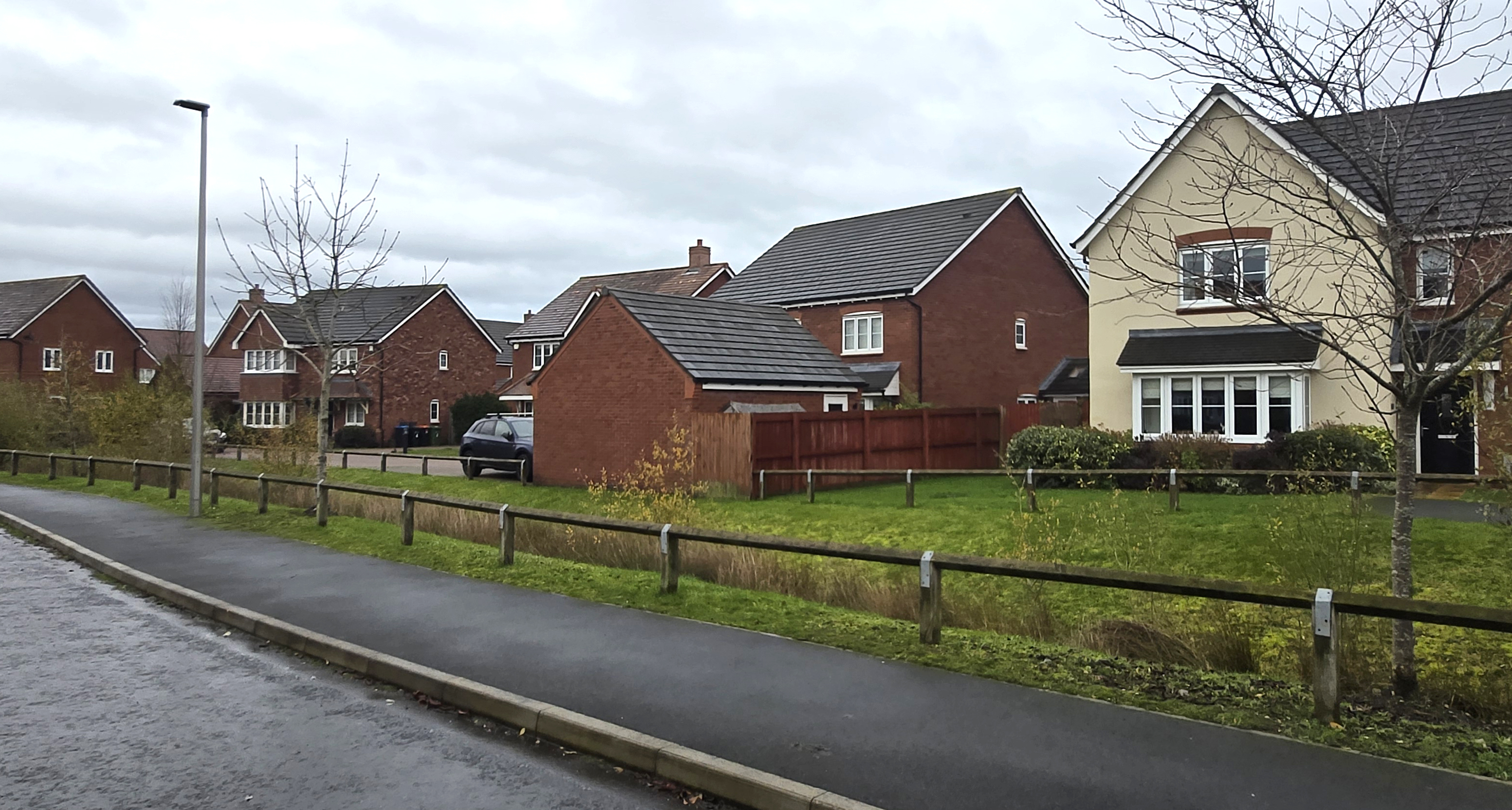 Examples of appropriate front parking, where the driveways do not occupy the entire width of the plot and hedging is used to soften the presence of cars and hardstanding