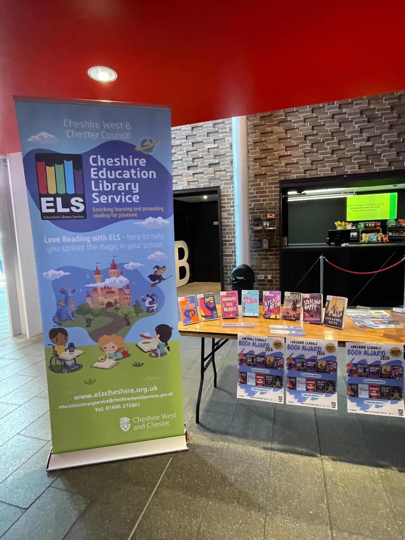 Books on display with a pull up banner