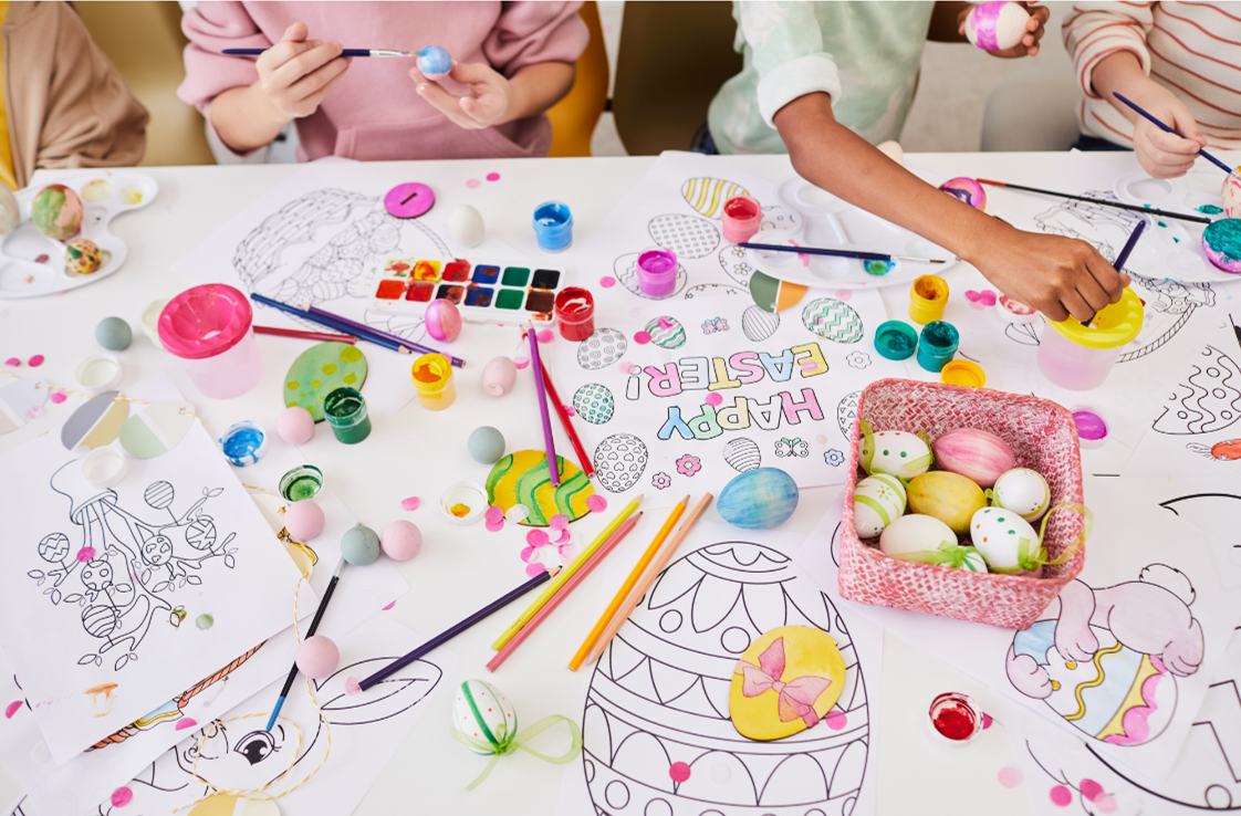 A table of Easter colouring sheets and egg painting