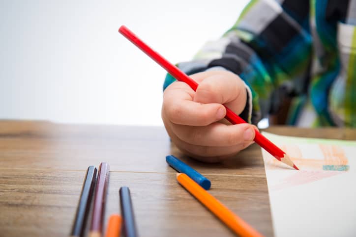 Child colouring in their drawing for the competition.