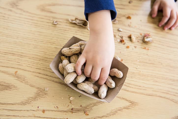 Child reaching for nuts