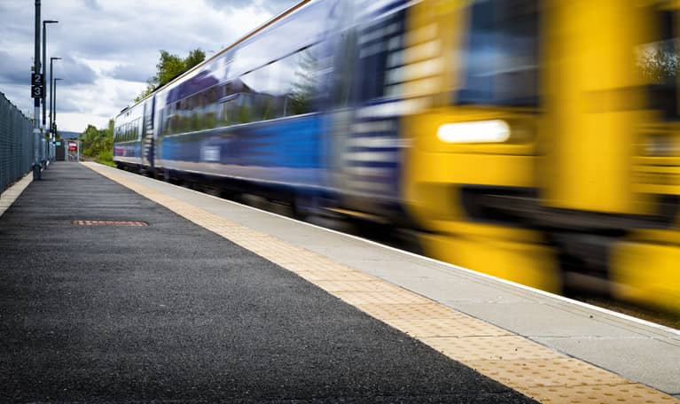 Train going past railway station
