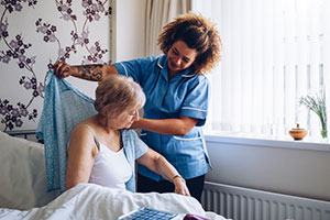 Woman getting help dressing