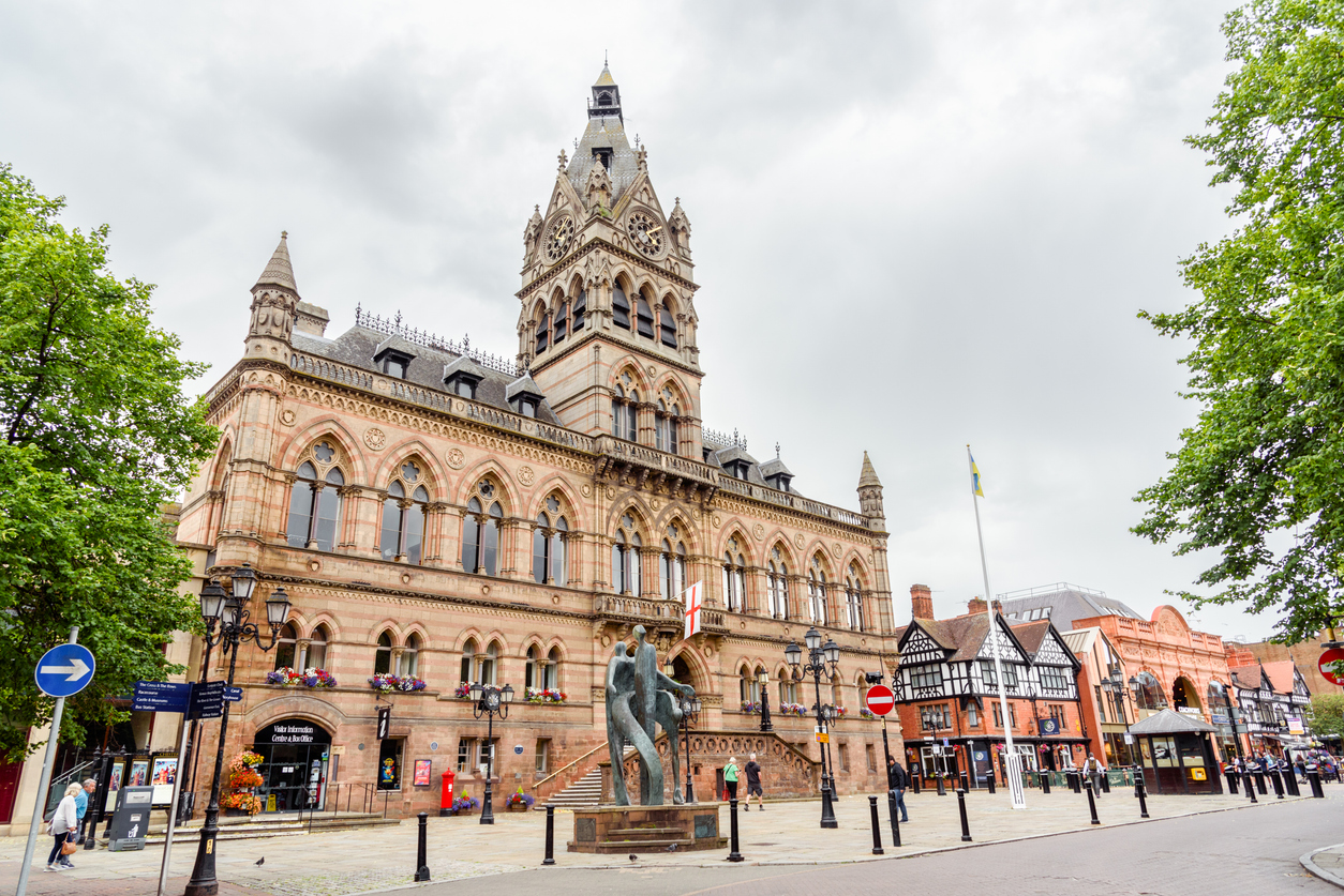 A picture of a large building in the middle of the city centre.