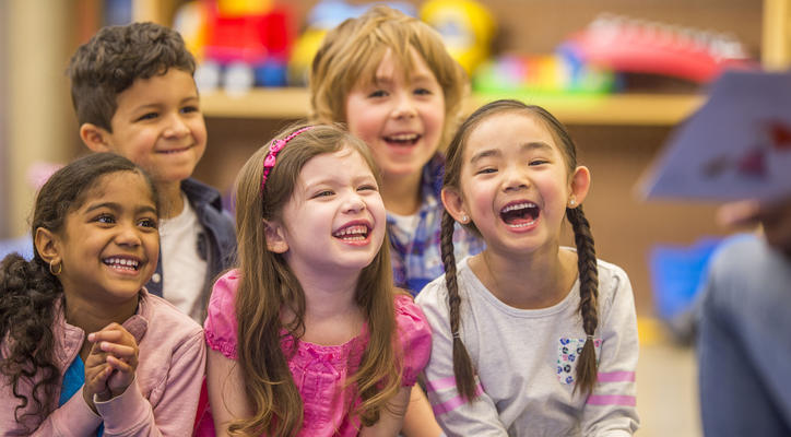 Children laughing in a group setting