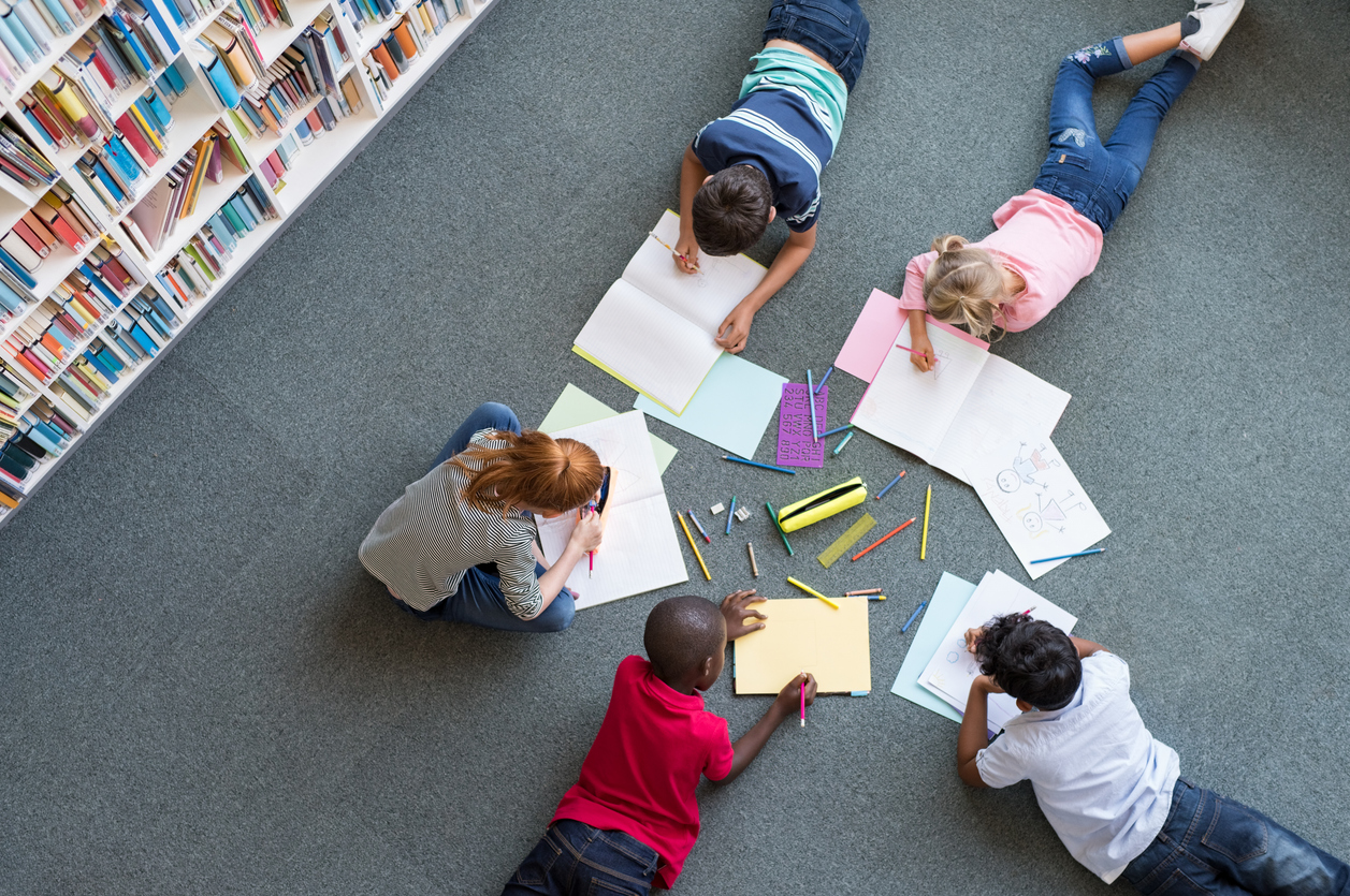 Children writing and drawing