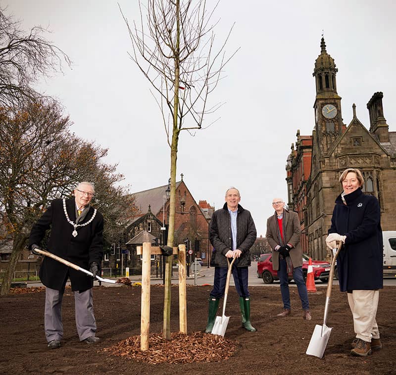 Members planting the tree