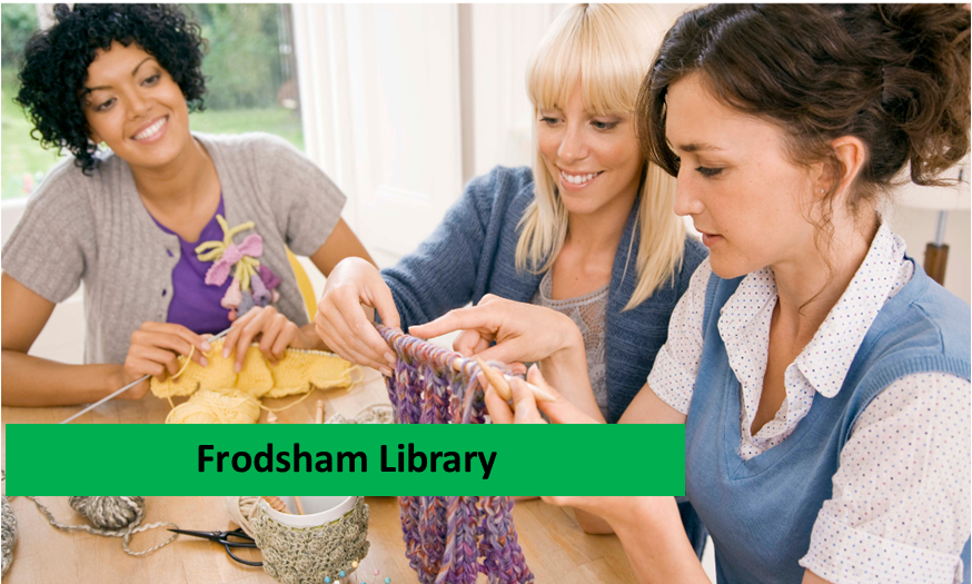Women sitting together at a table knitting