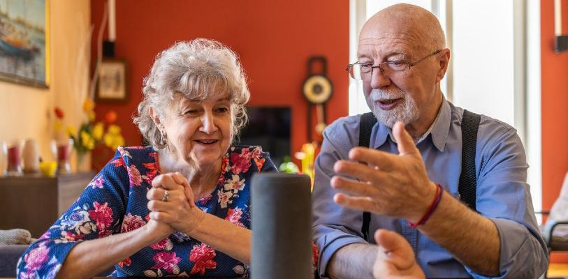Two older people having a conversation