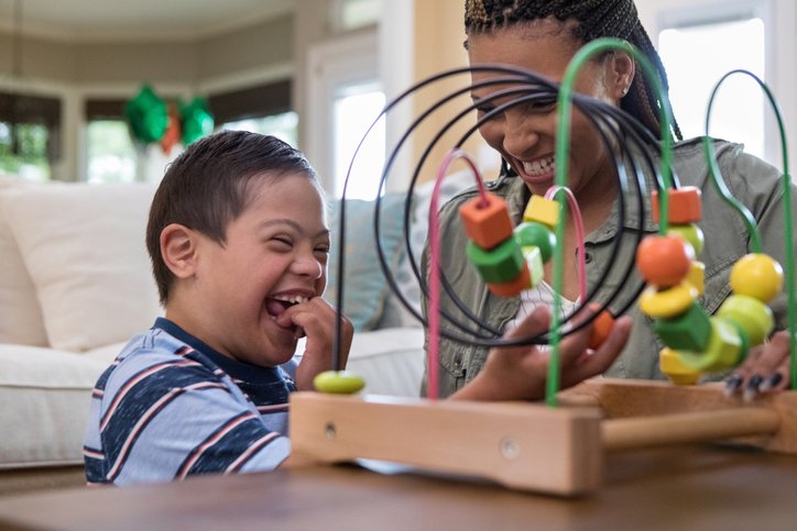 Child playing with staff member at the home.