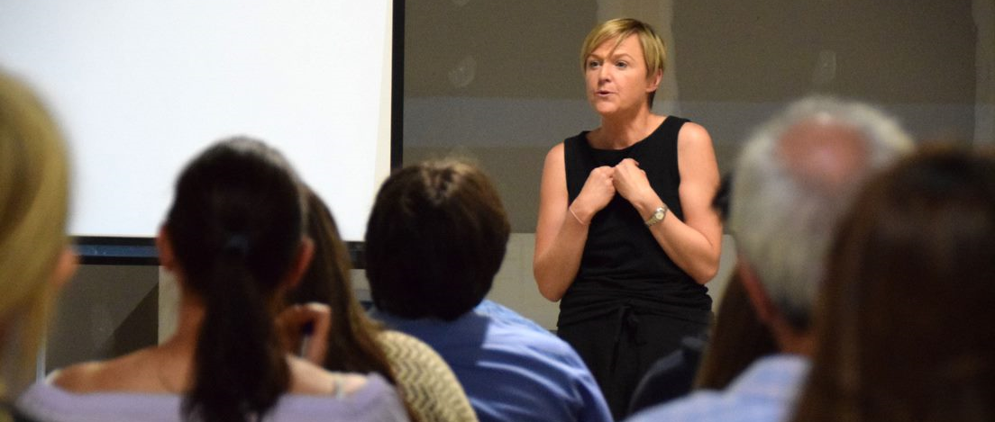 Katie Coombes, lead trainer at Rebel Business School, speaks during a business course
