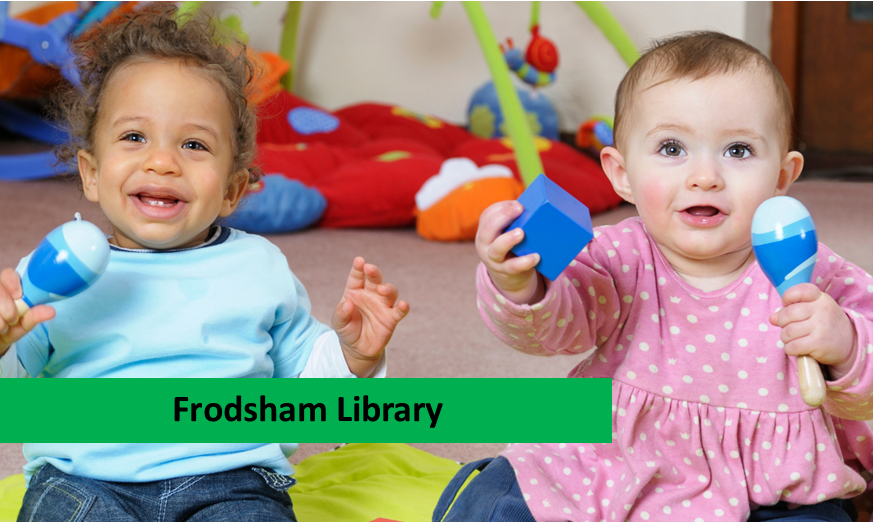 Two toddlers holding maracas