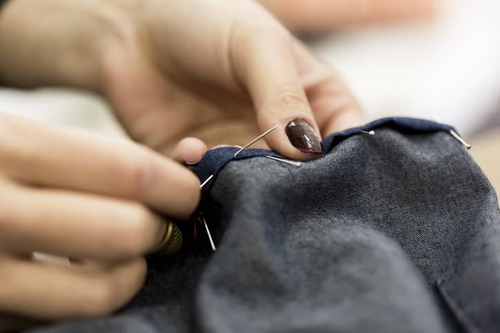 Woman stitching a jacket