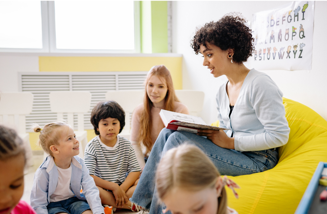 A lady reading stories to children