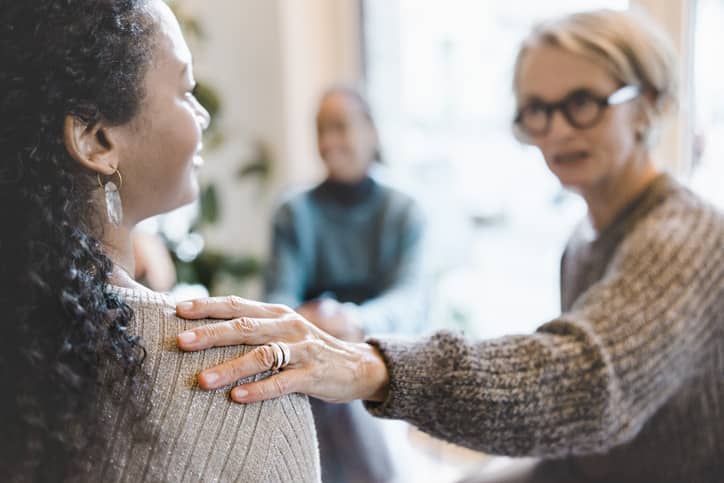 People talking at a support group.