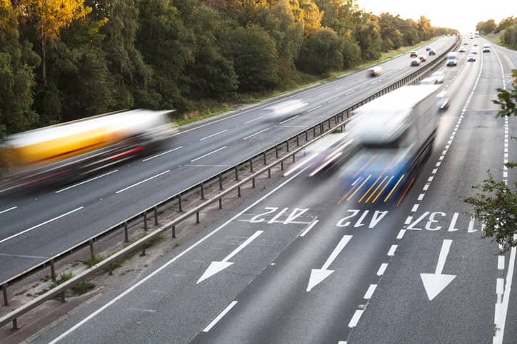 Lorries and cars driving on the motorway