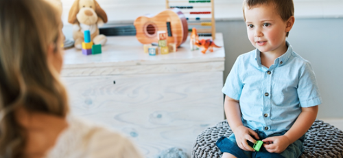 A child talking to a woman
