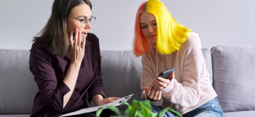 A woman and a teenage girl talking