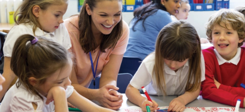 A woman supporting children's learning