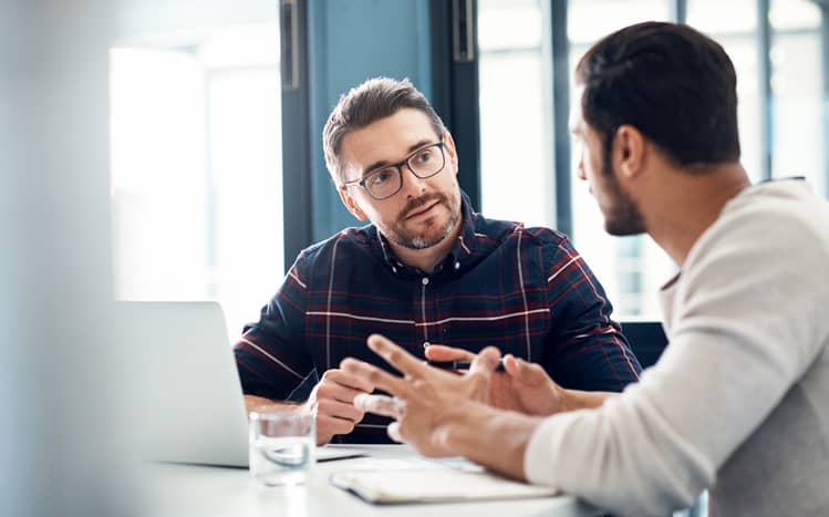 Adviser speaking with a youth