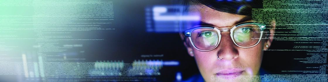 Thriving Council - Person looking at computer screen with data surrounding them