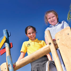 Two children in Winsford on play equipment at Town Park